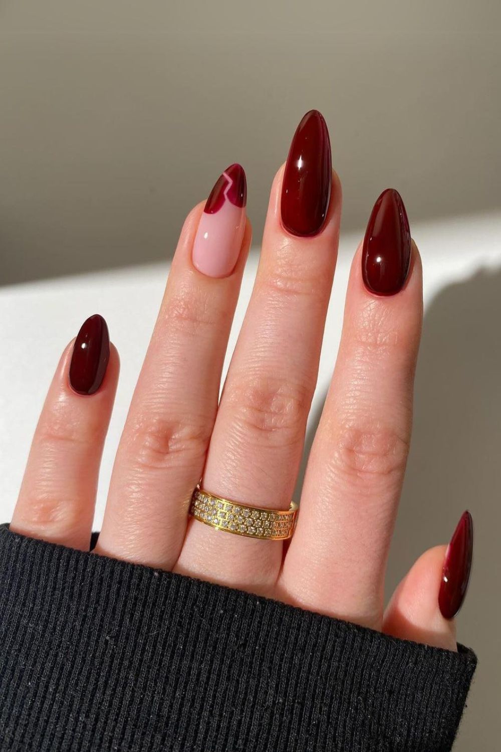 Burgundy nails with a heart accent