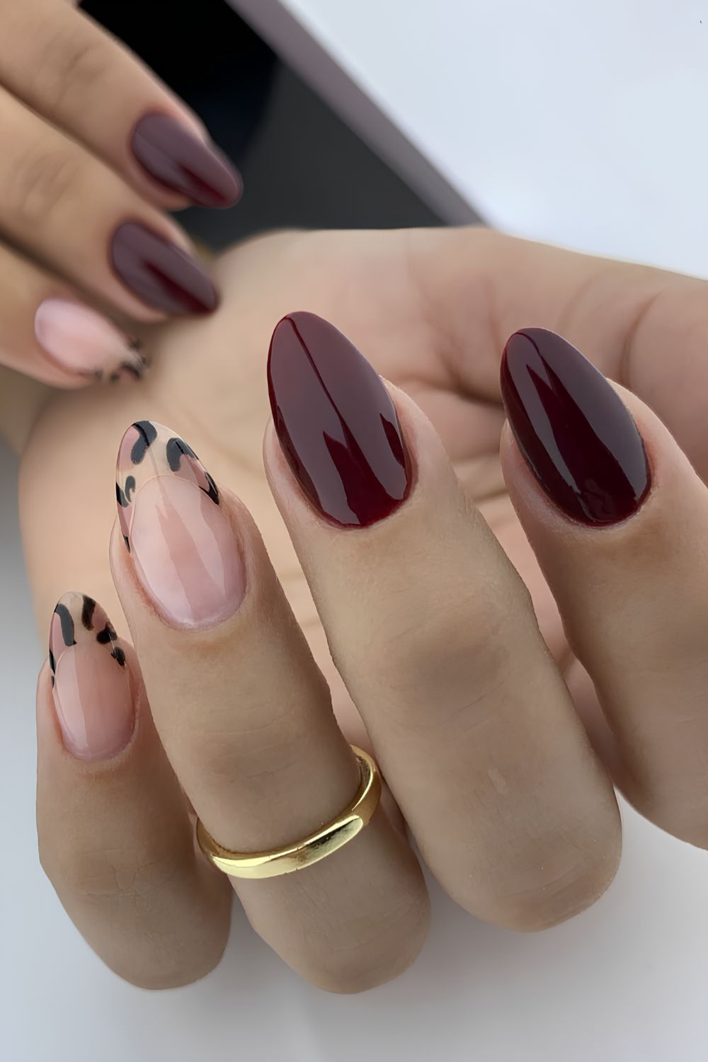 Burgundy nails with accent animal print