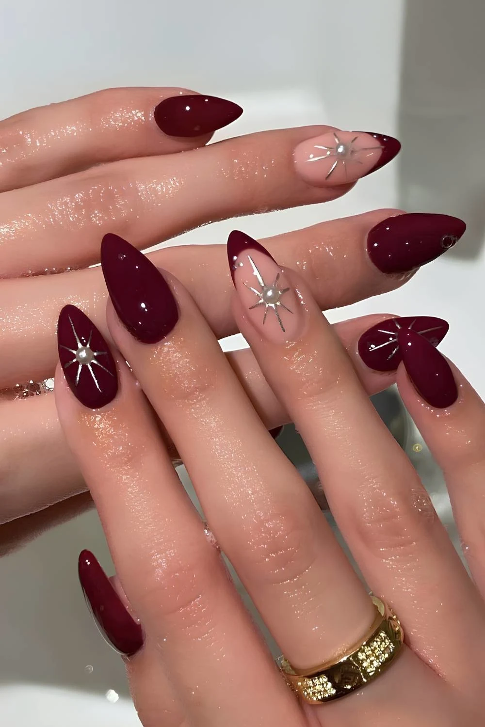 Burgundy nails with accent celestial art