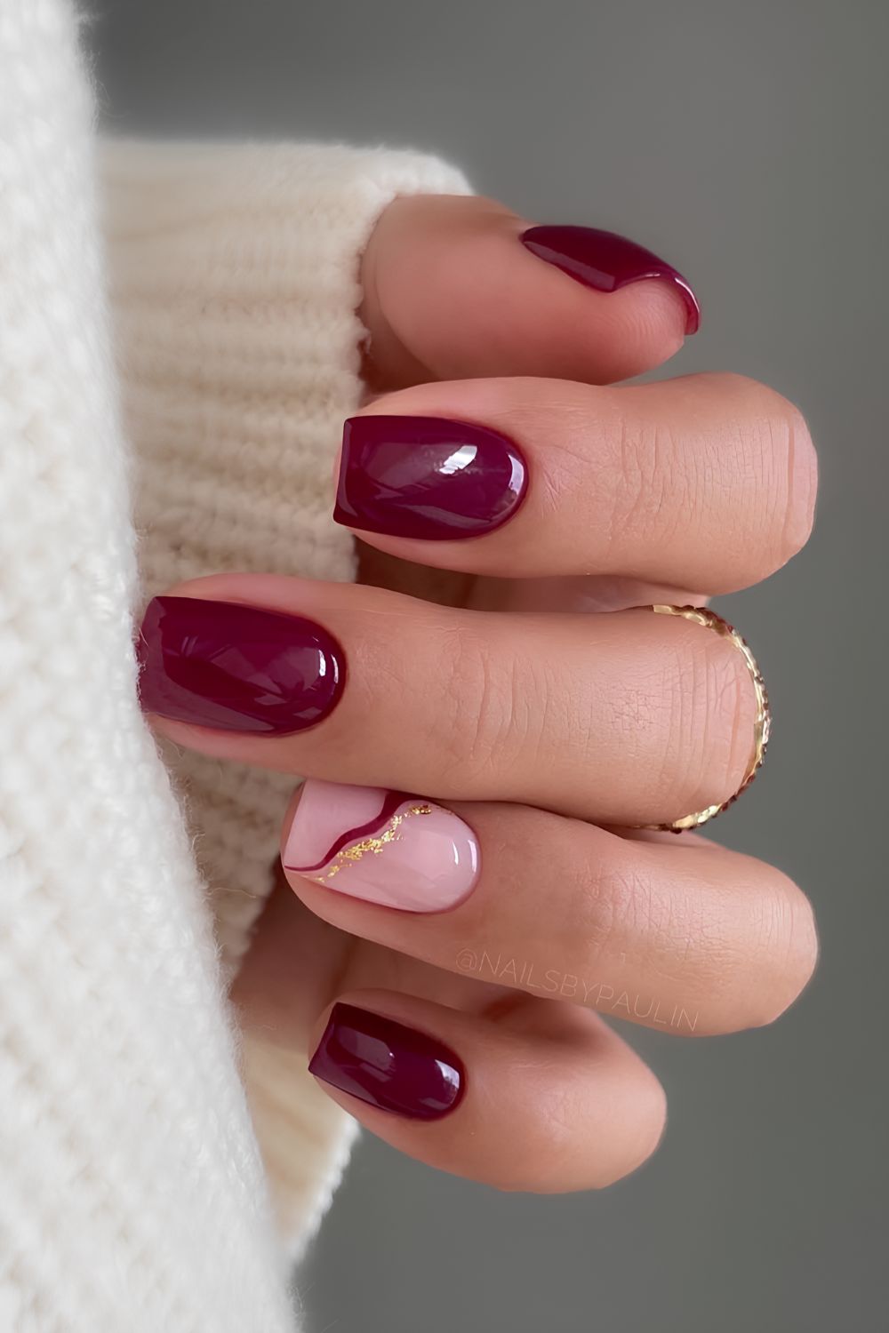 Burgundy nails with accent gold lines