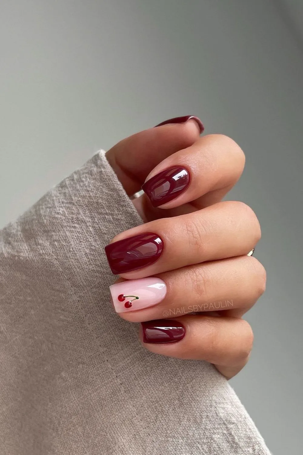 Burgundy nails with cherry accent