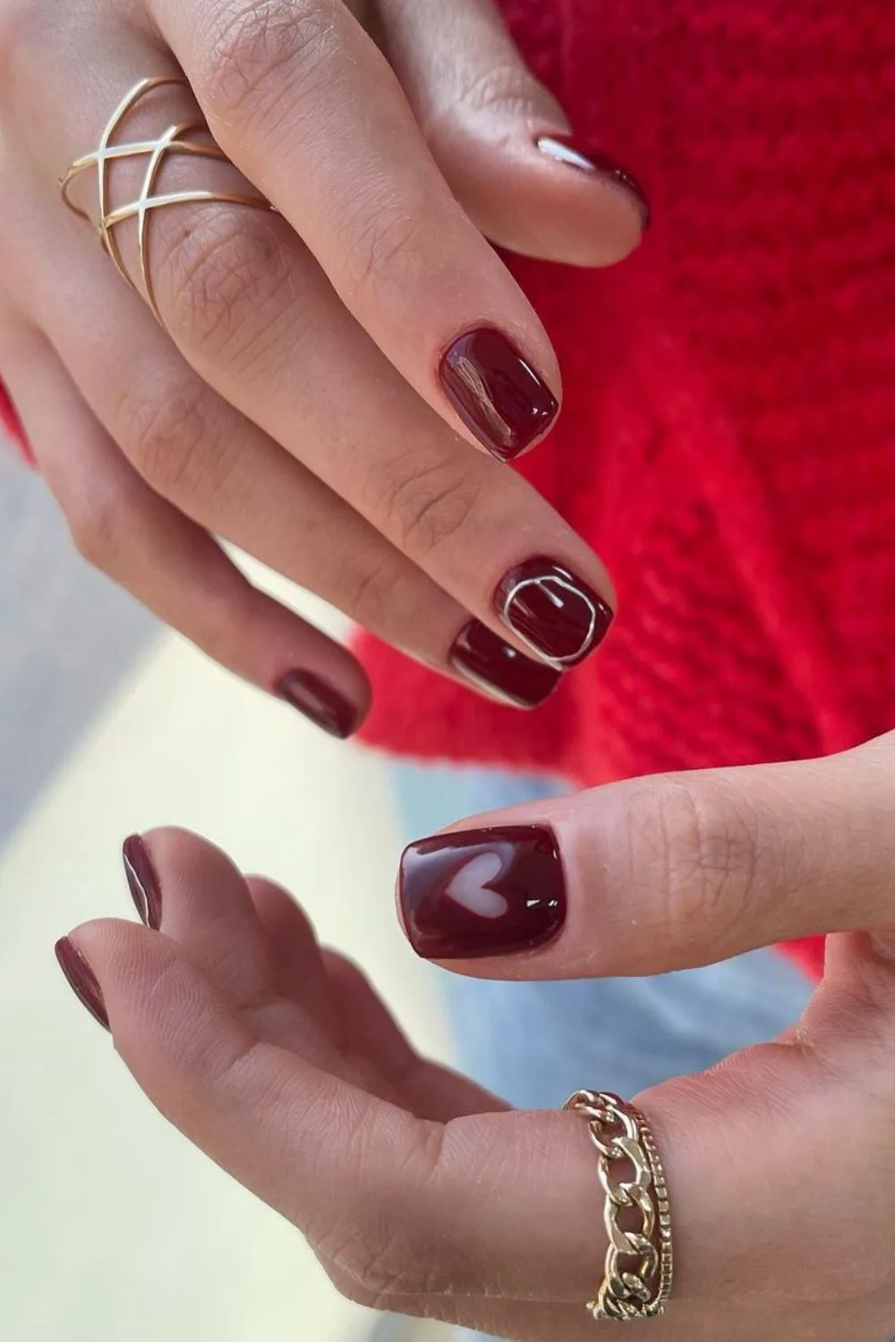 Burgundy nails with heart and chrome rings accents