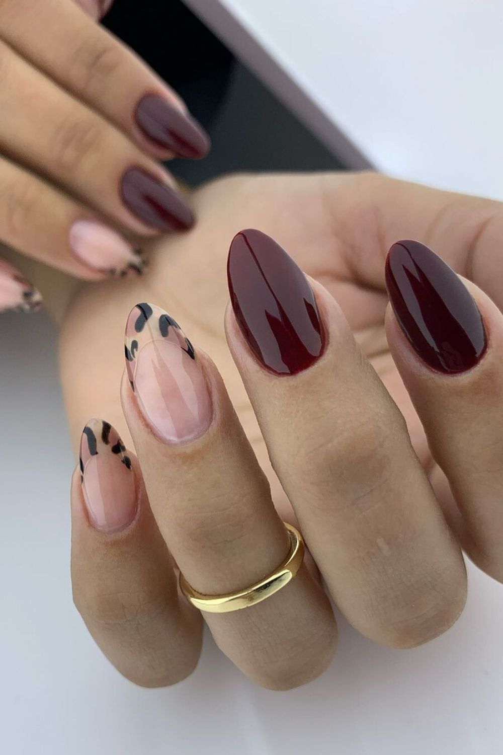 Burgundy nails with leopard accent tips