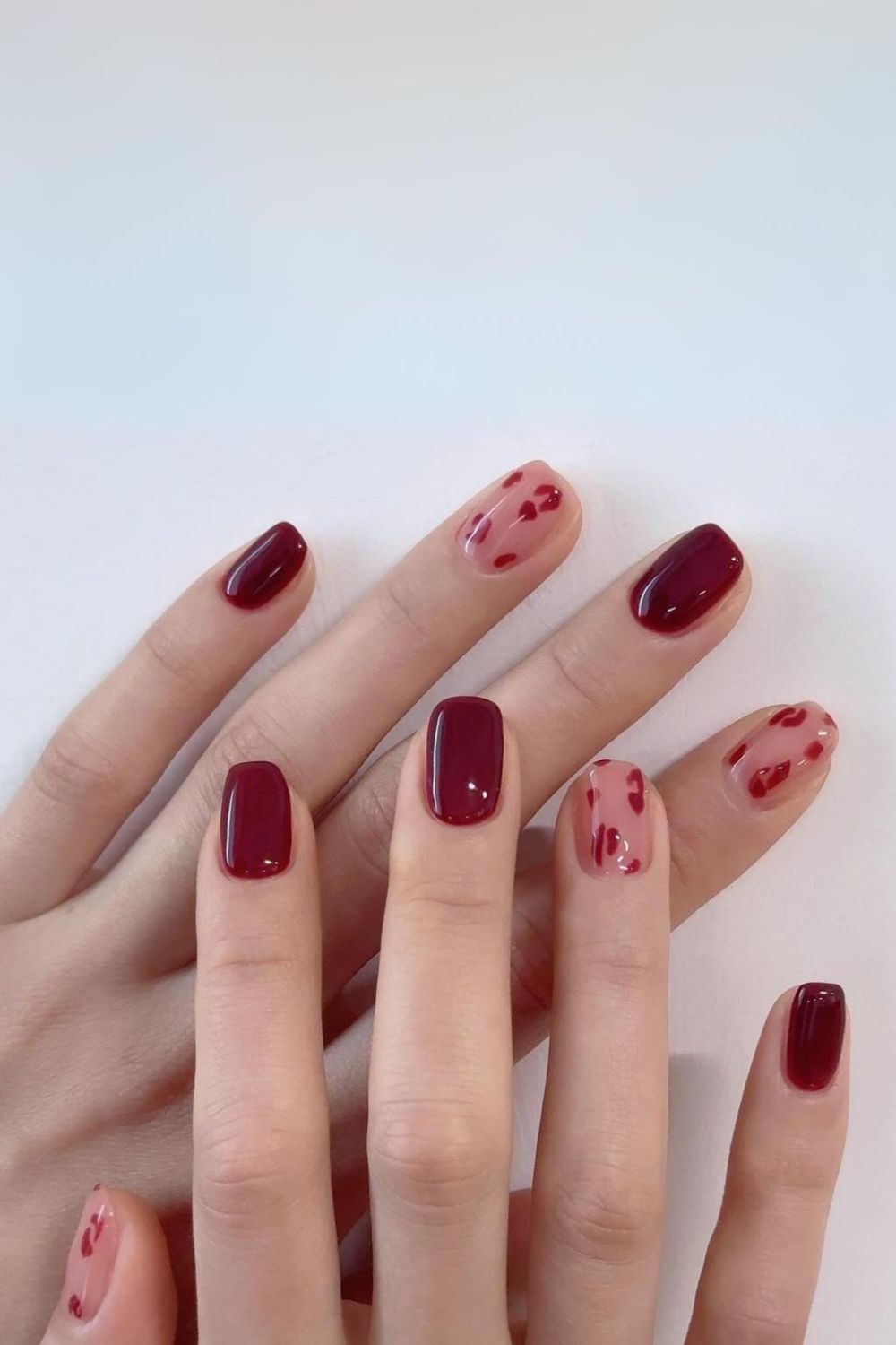 Burgundy nails with leopard spots