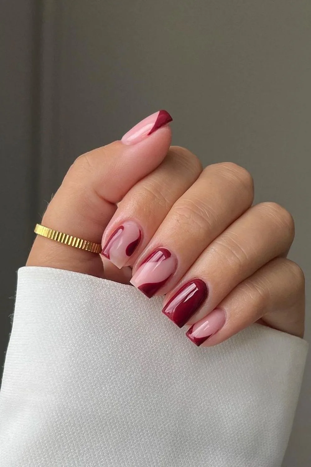 Burgundy nails with negative space accent