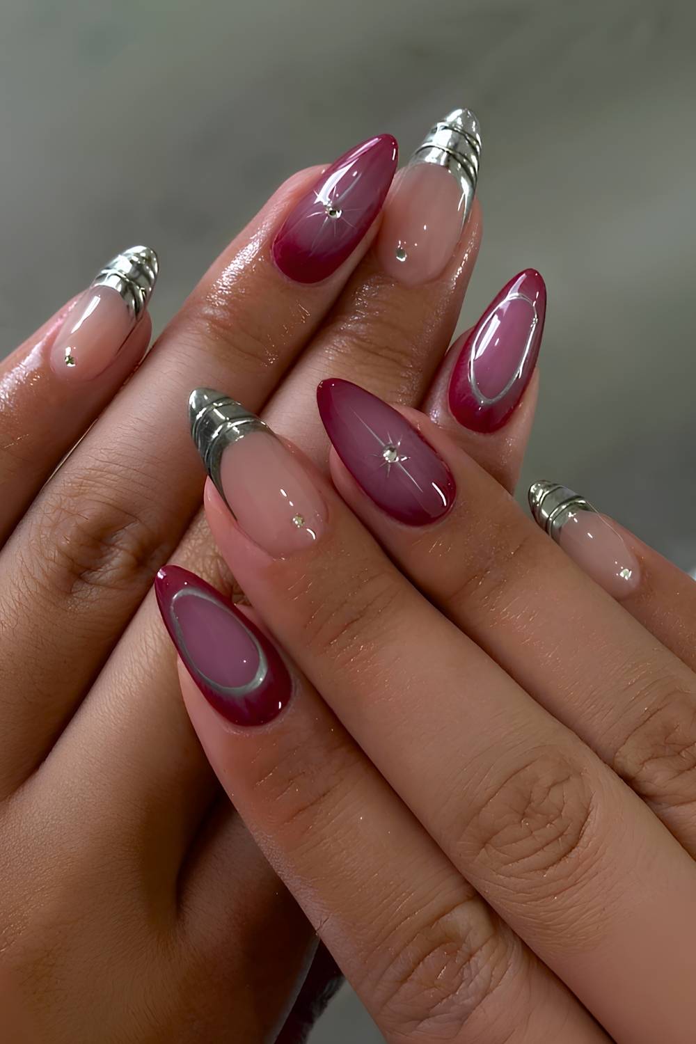 Burgundy nails with silver chrome accents