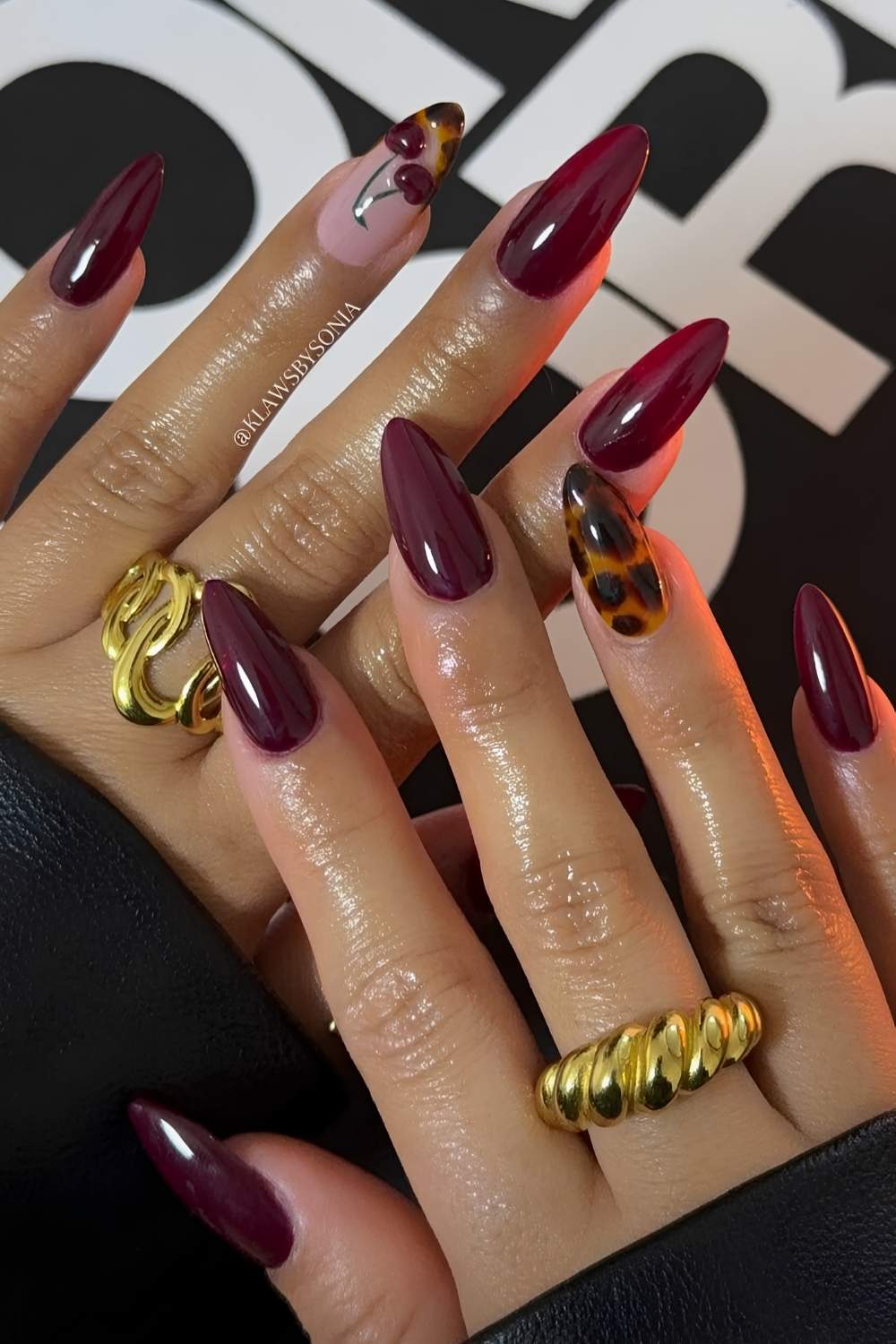Burgundy nails with tortoise shell and cherry art