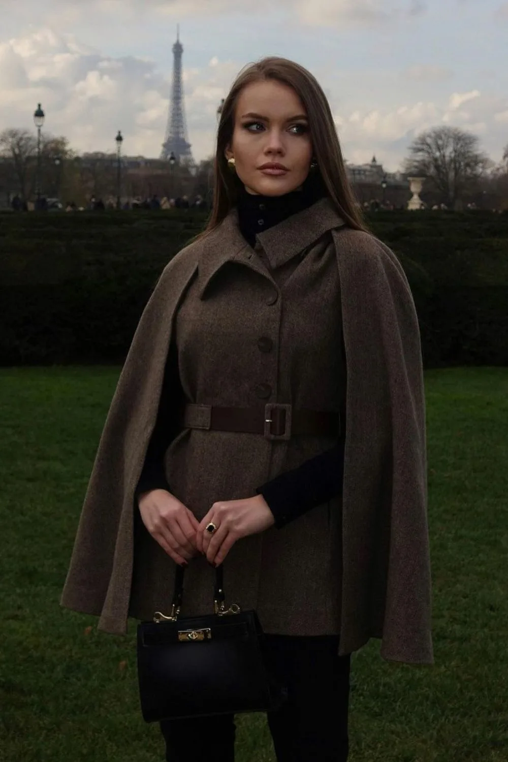 Cape coat with belted waist and black turtleneck