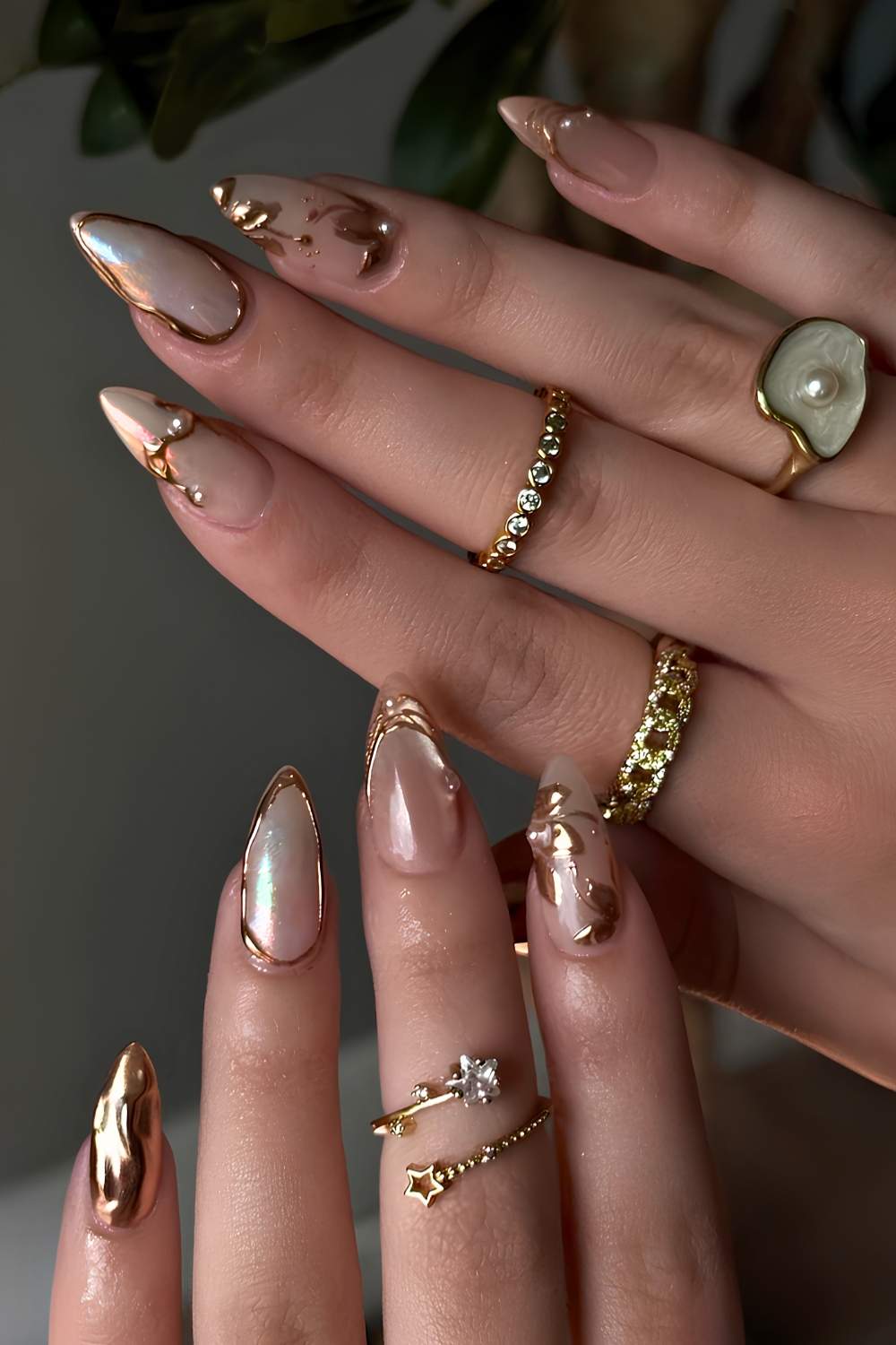 Cat eye nails with gold flowers and lines