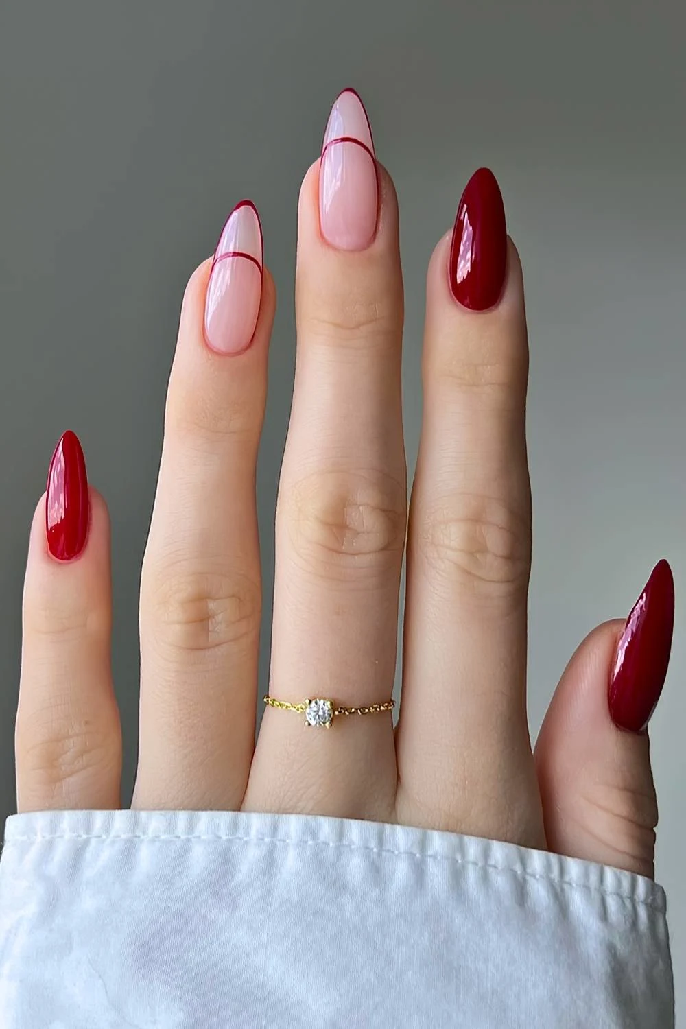 Cherry red nails with accent French tip outlines