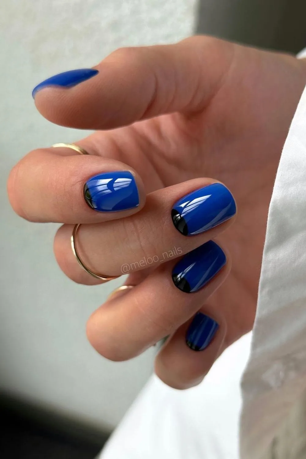 Cobalt blue nails with black half moon design