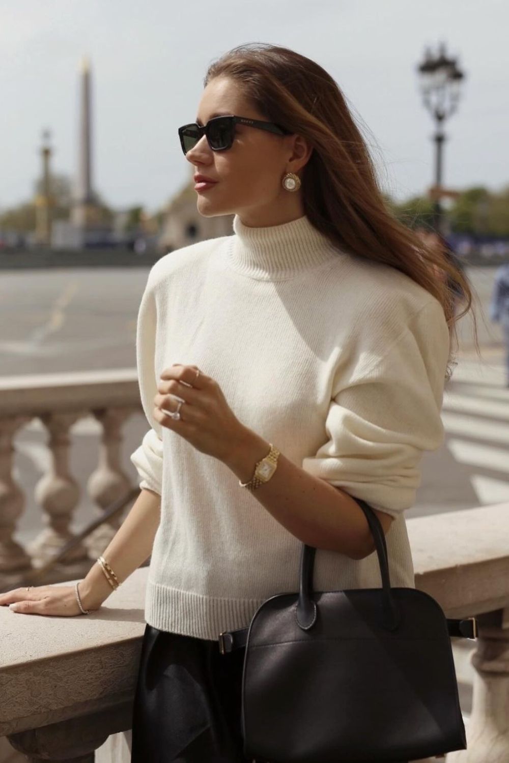 Cream turtleneck sweater with black skirt