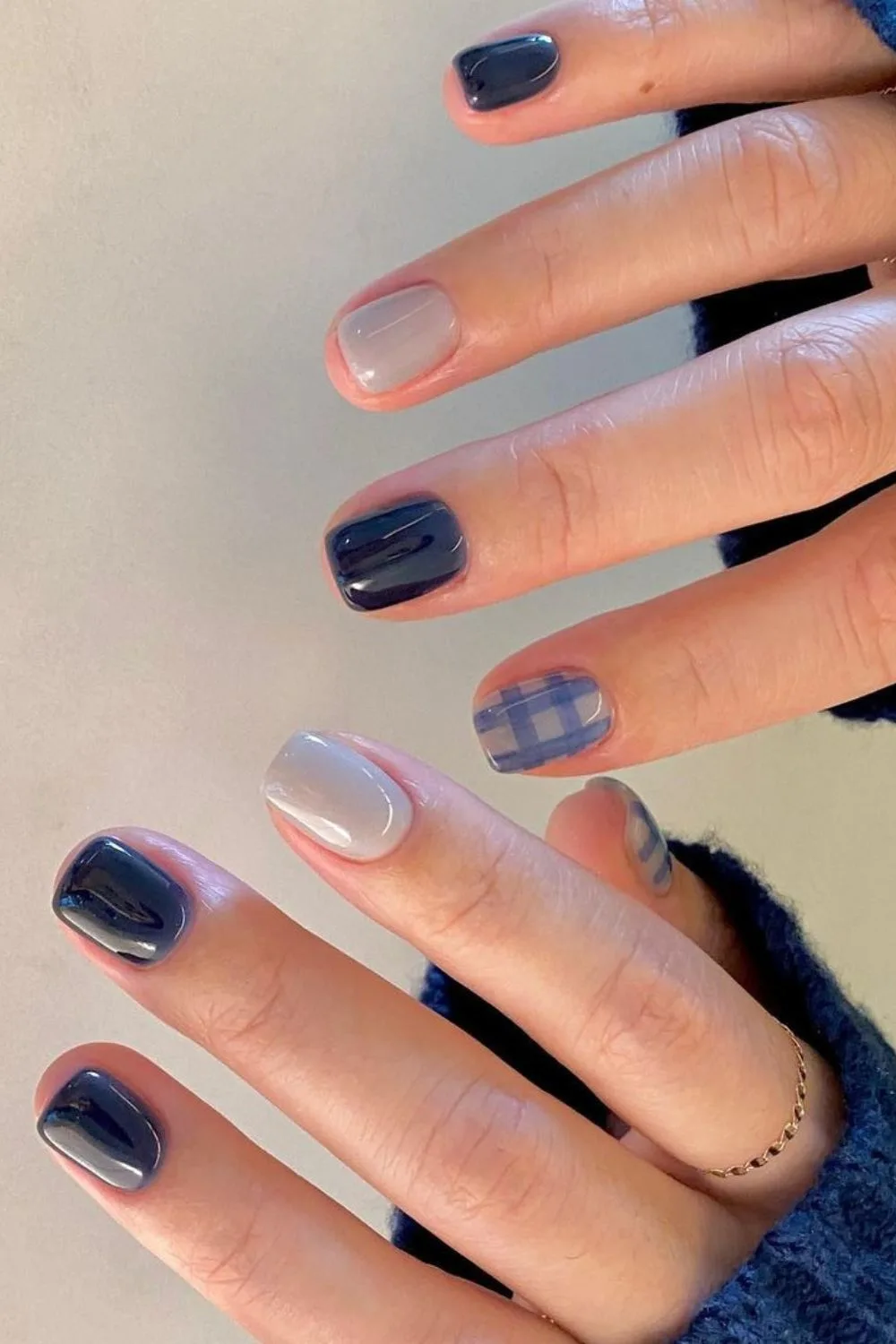 Dark blue nails with gray and plaid accent