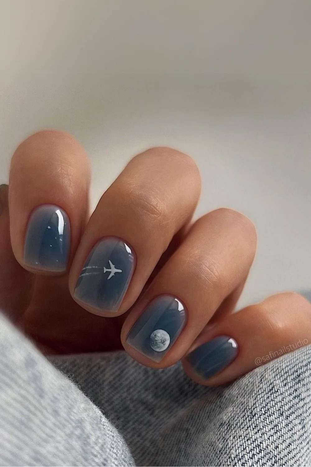 Dark blue nails with night sky details