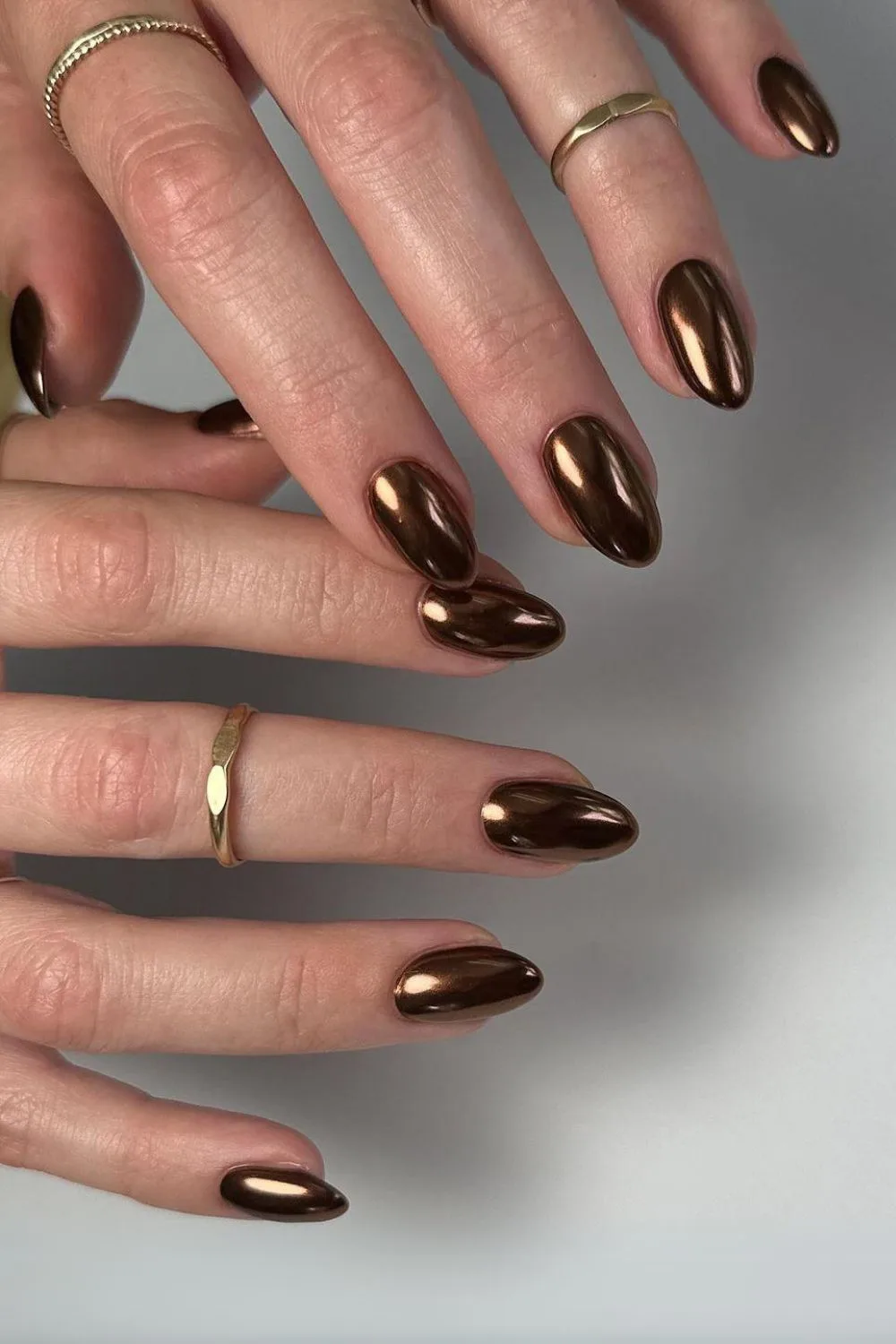 Dark brown chrome nails