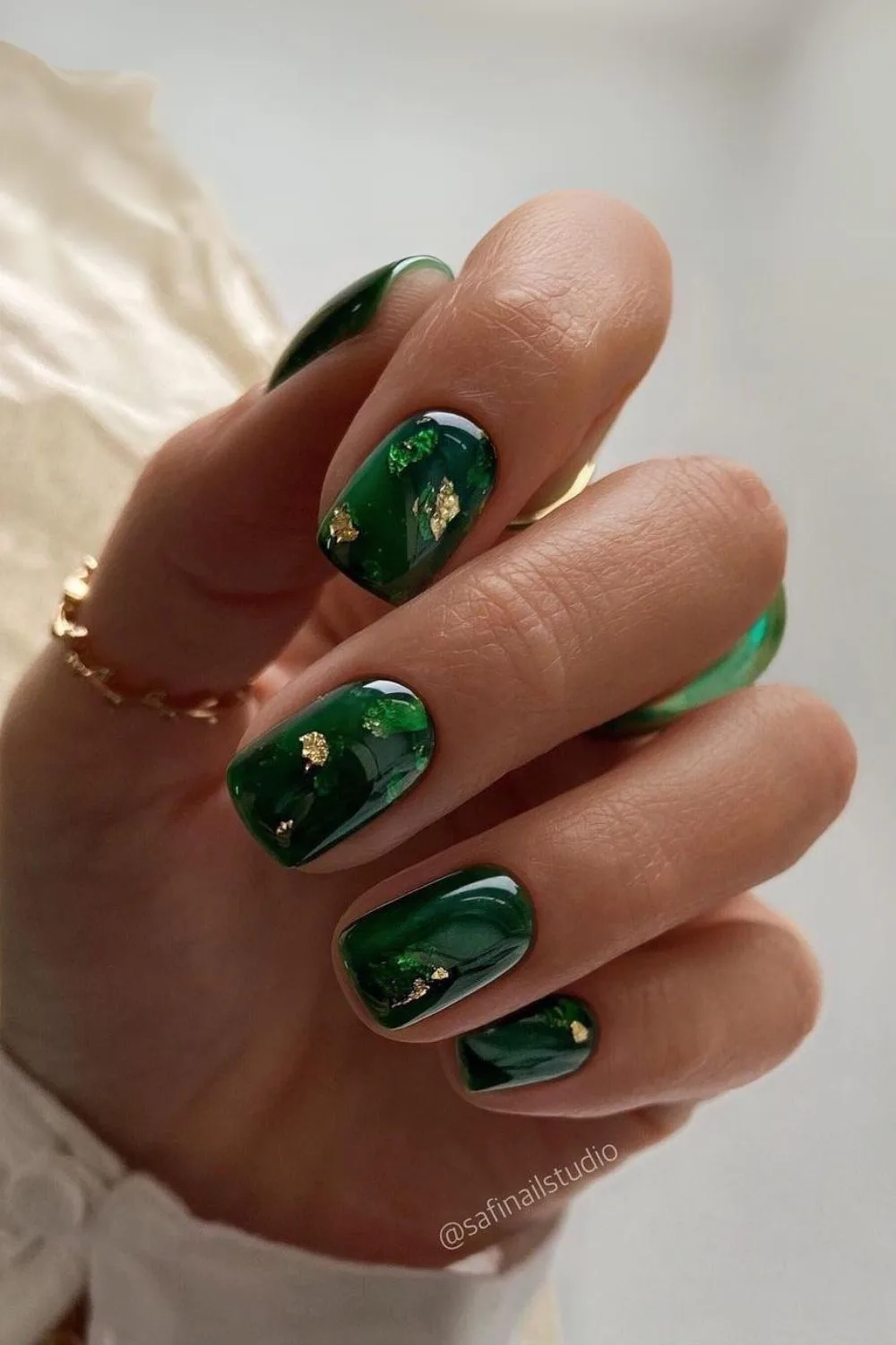 Dark green mani with gold accents