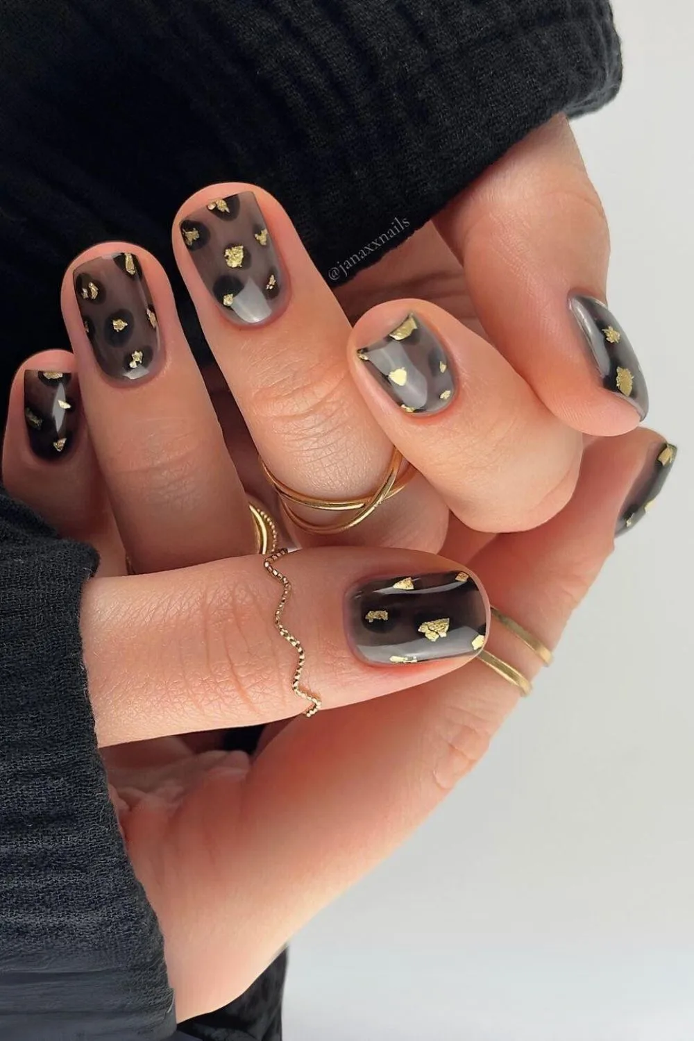 Dark leopard nails with gold foil accents