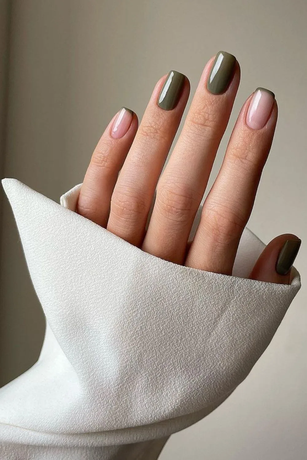 Deep olive nails with thin french tip design