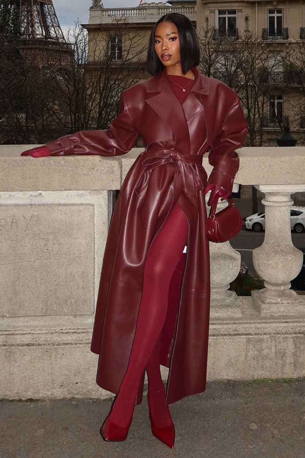 Deep red leather trench coat with matching tights