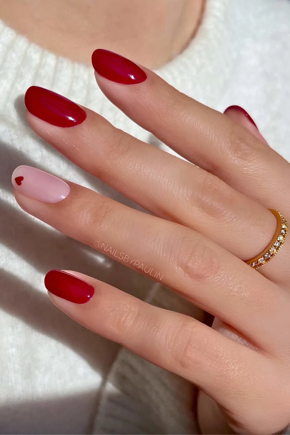 Deep red nails with heart art