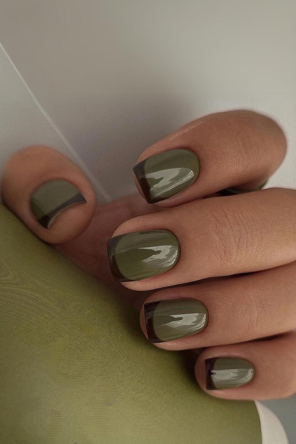 Earthy green nails with black French tips