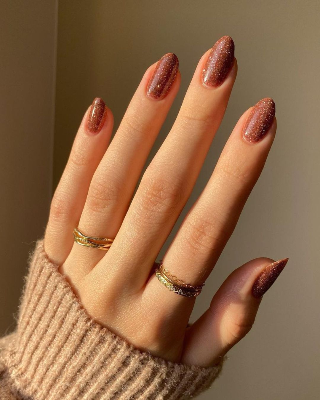 Glittery caramel brown nails