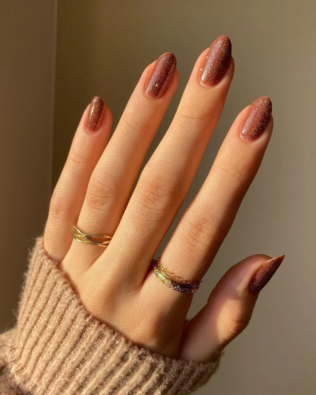 Glittery caramel brown nails