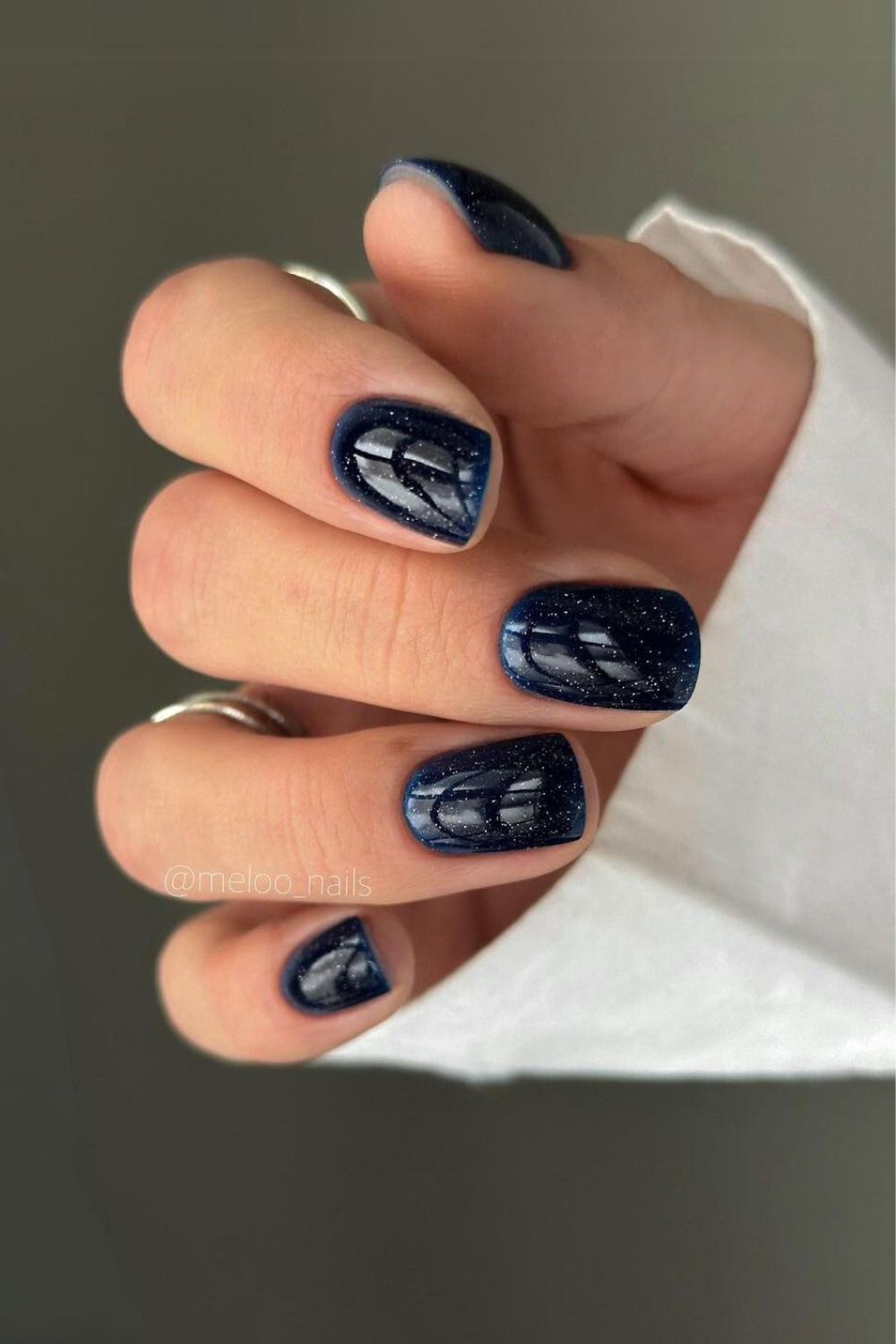 Glittery navy blue nails