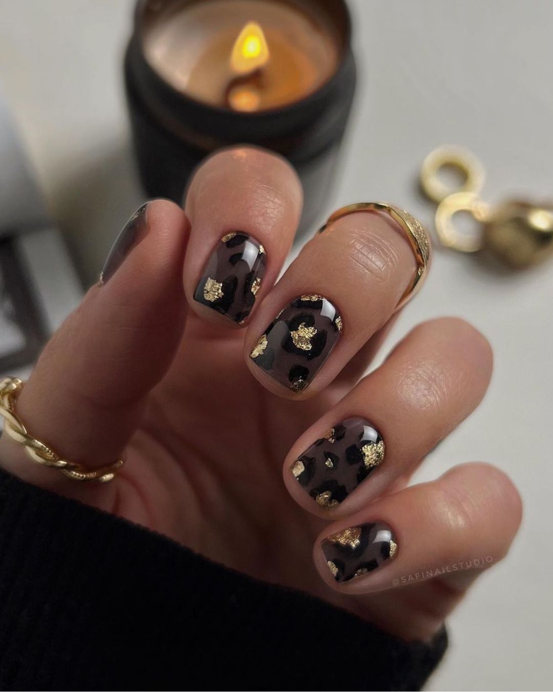 Gold and black leopard nails