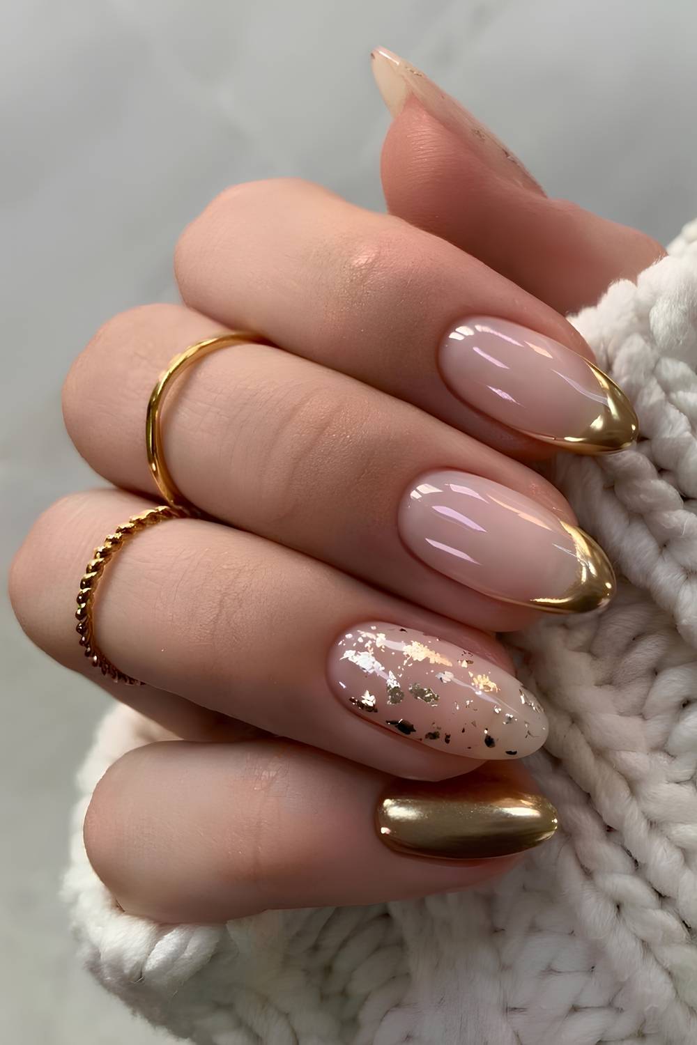 Gold chrome nails with foil flake accents