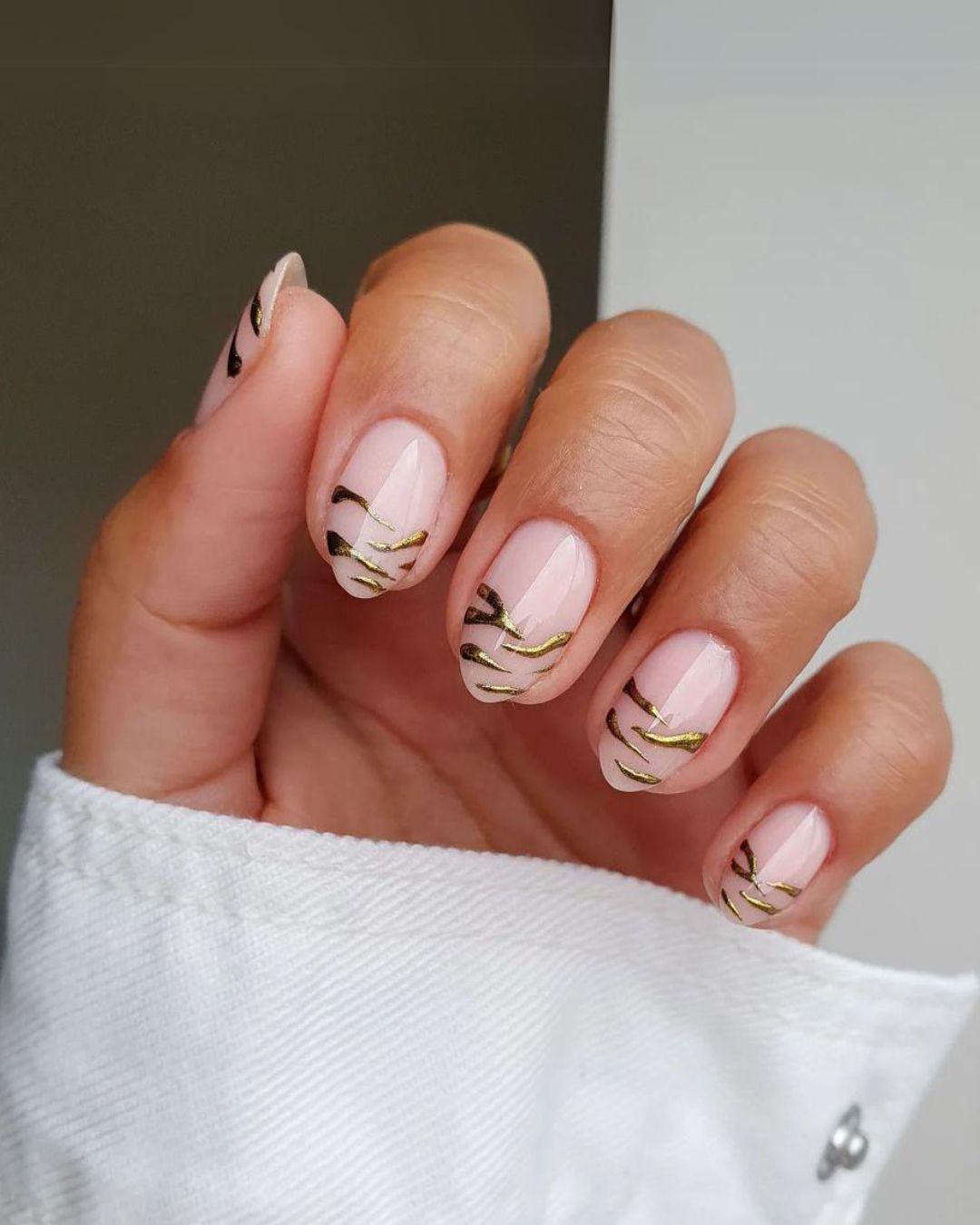 Gold zebra french tip nails