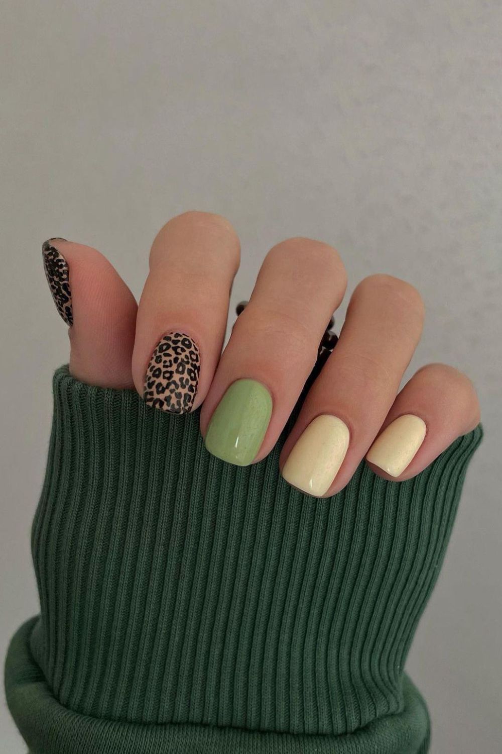 Green and butter yellow nails with leopard accent