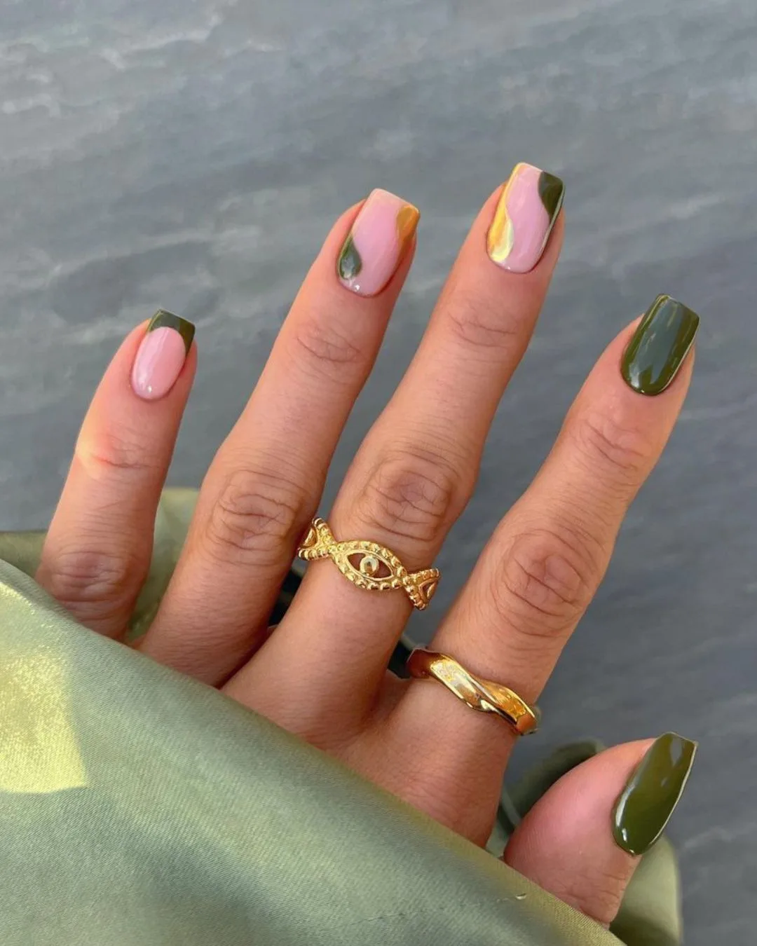 Green and gold nails with negative space