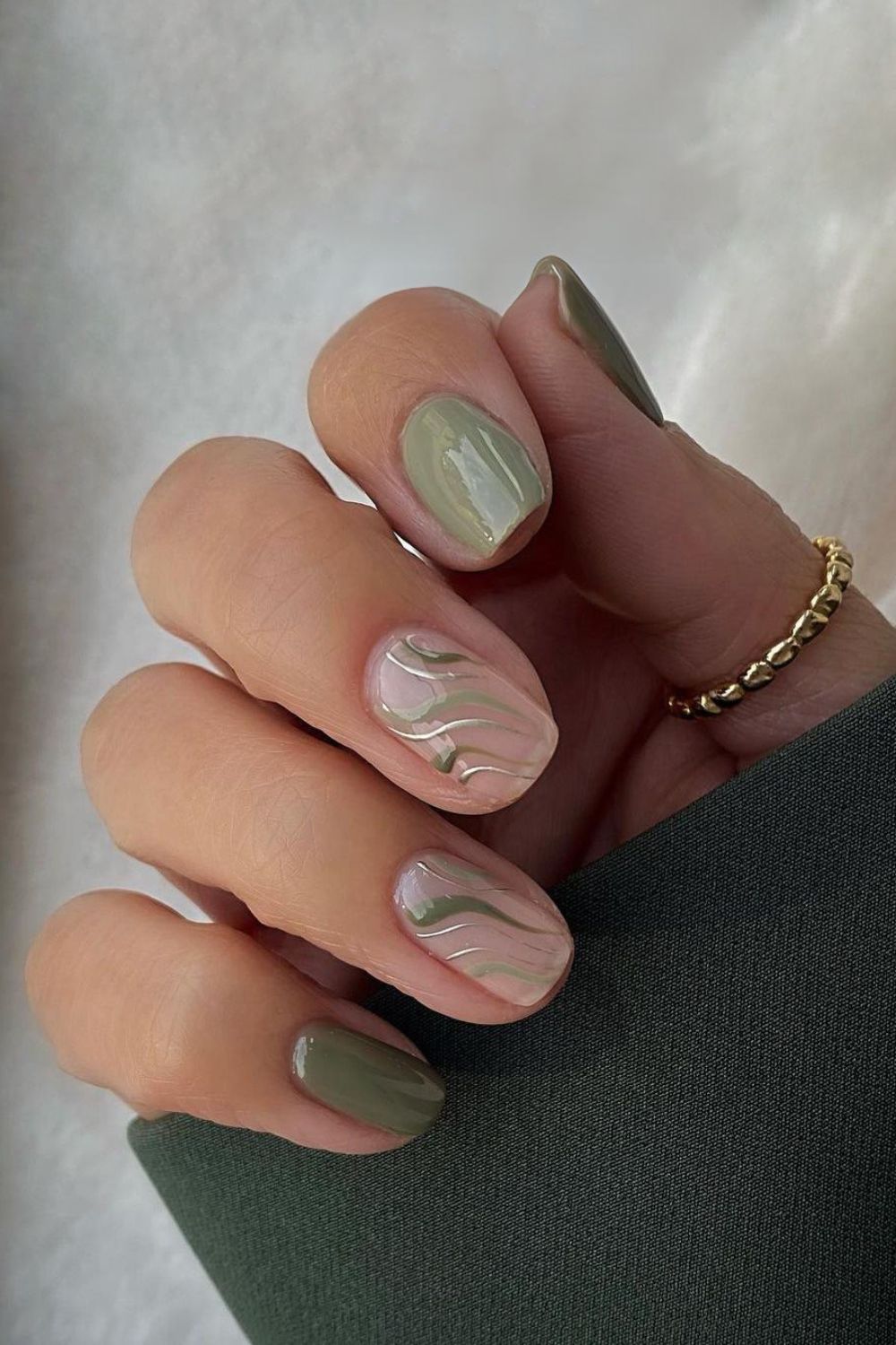 Green nails with silver accents