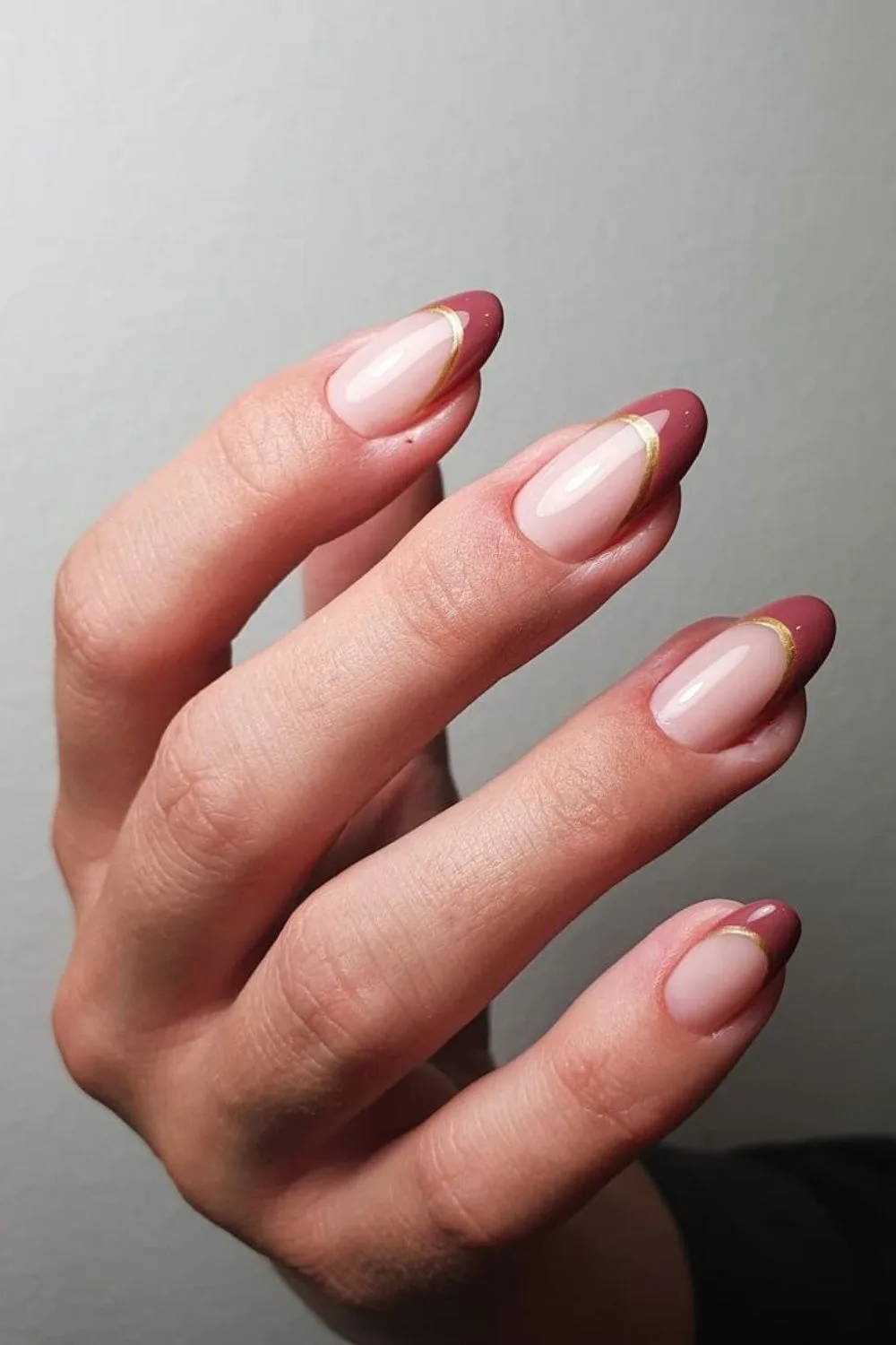 Mauve French nails with gold outline