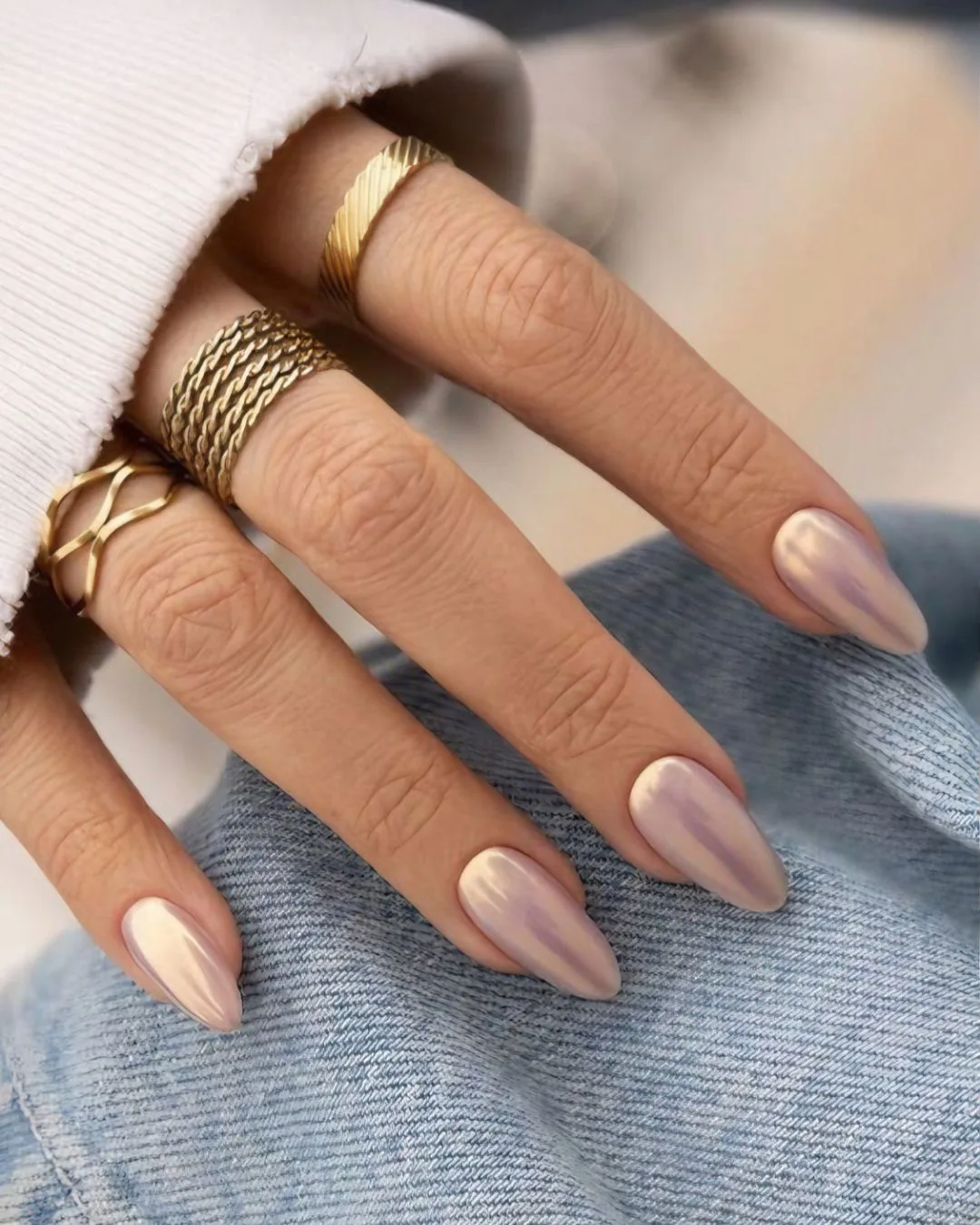 Metallic nude nails with gold shine