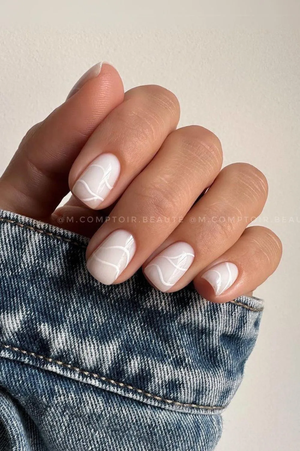 Milky nails with abstract lines