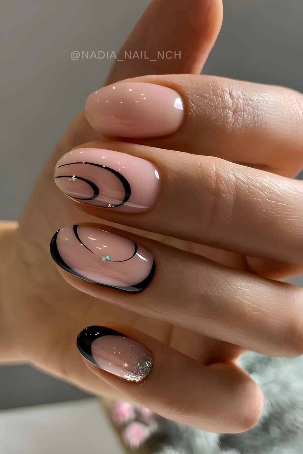Milky nails with black swirl art