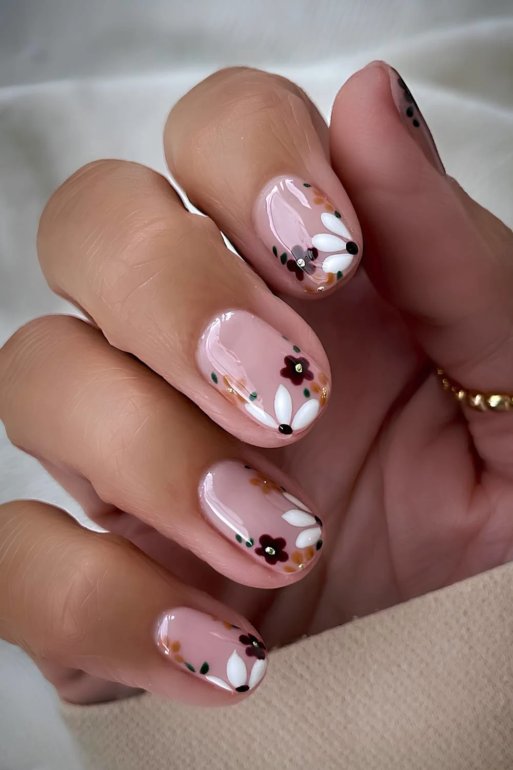 Milky nails with floral art in fall colors