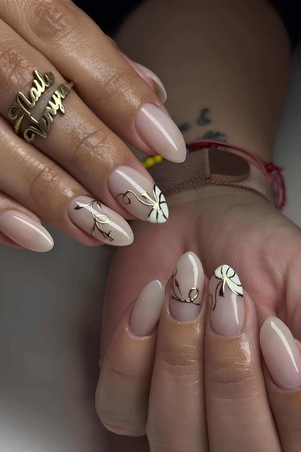 Milky nails with white and gold pumpkin art