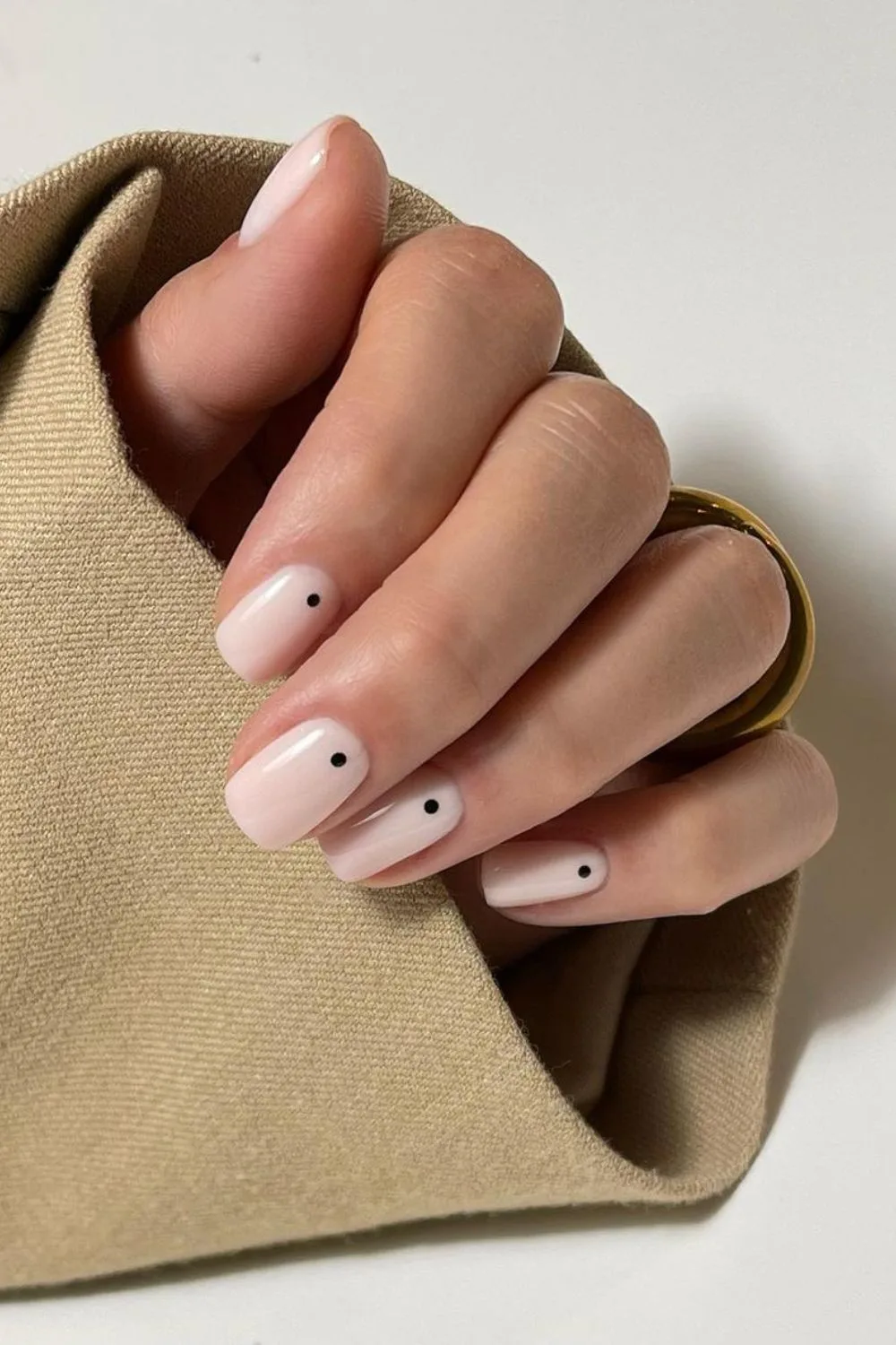 Milky white mani with black dot accents