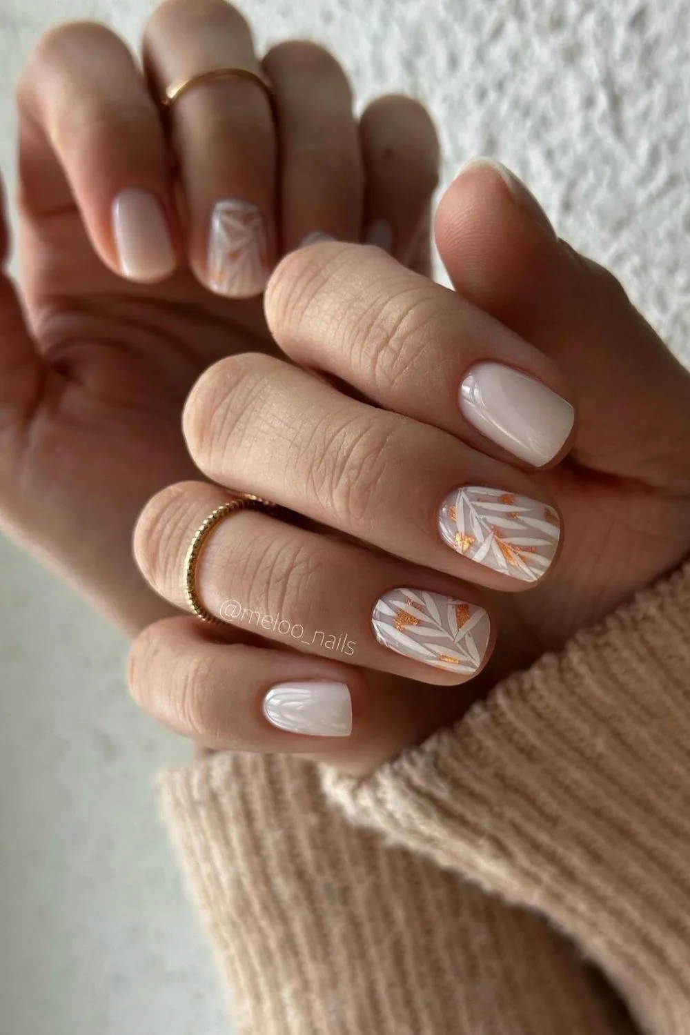 Milky white mani with leaf designs