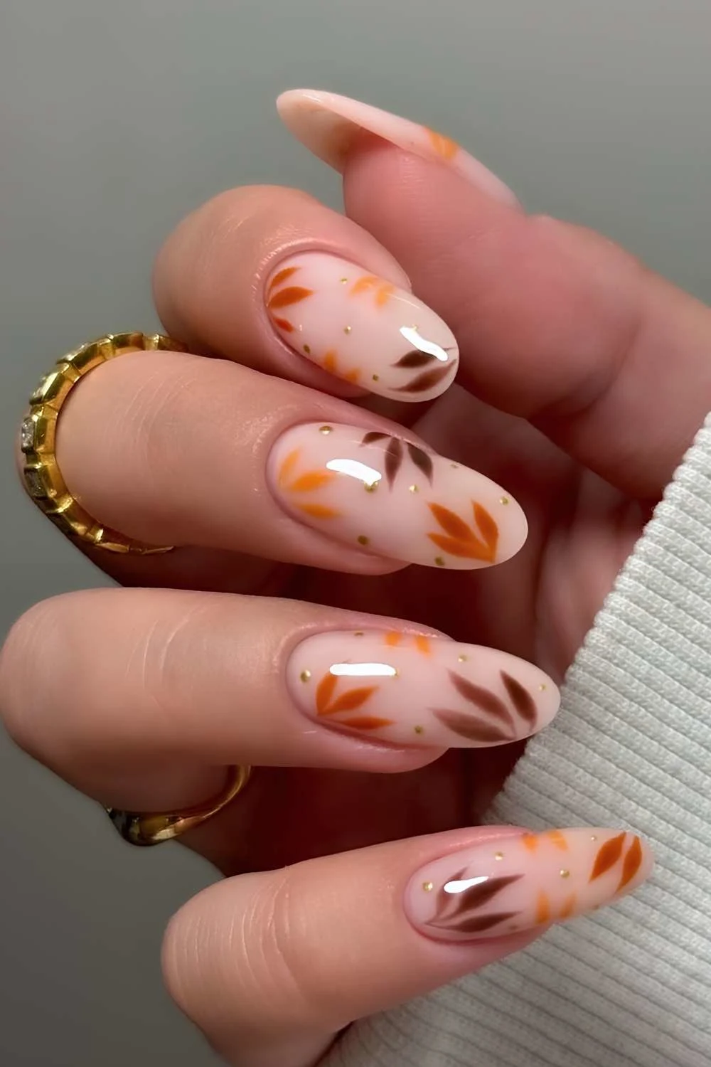 Milky white nails with fall leaf art