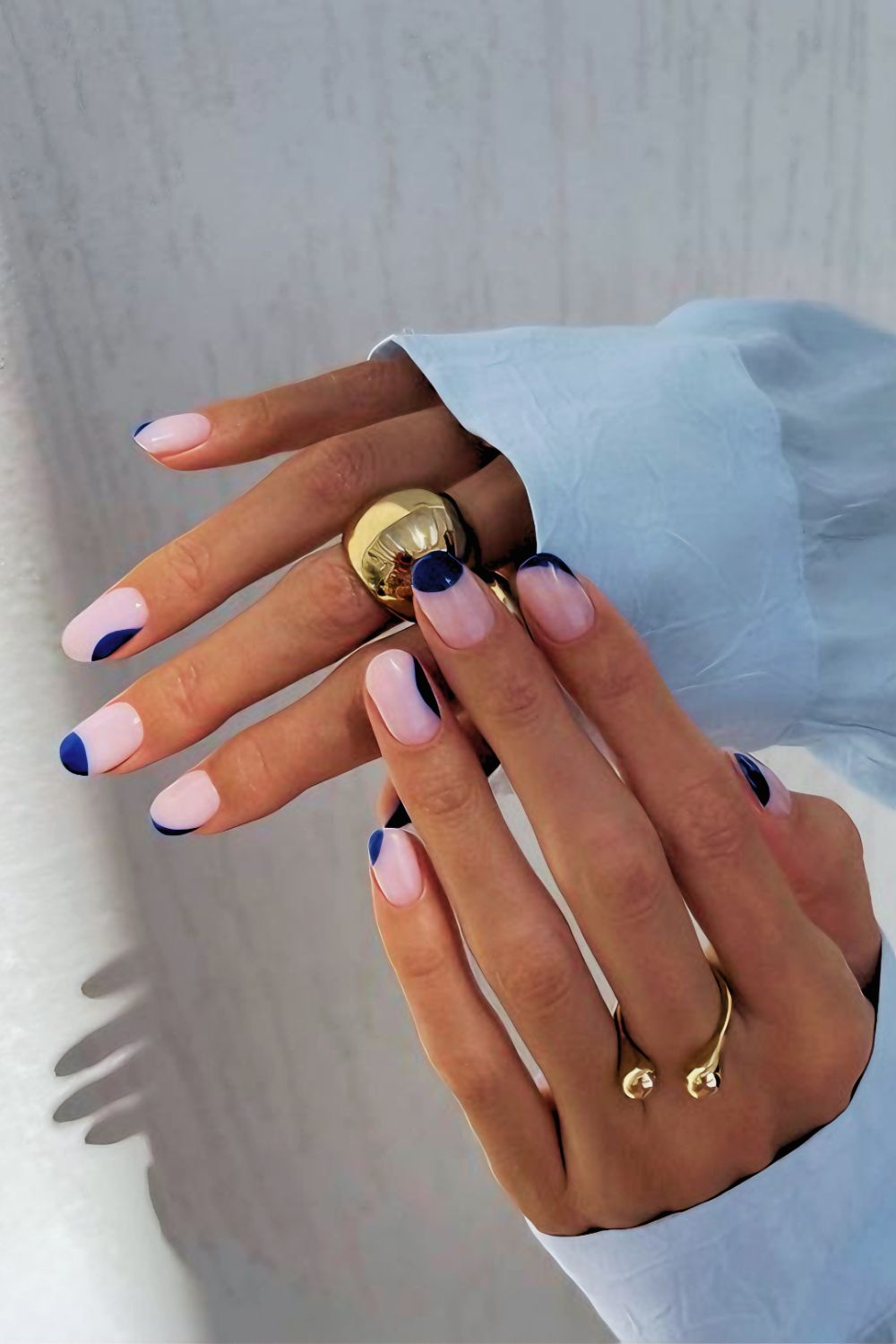 Navy blue and soft pink abstract nail design