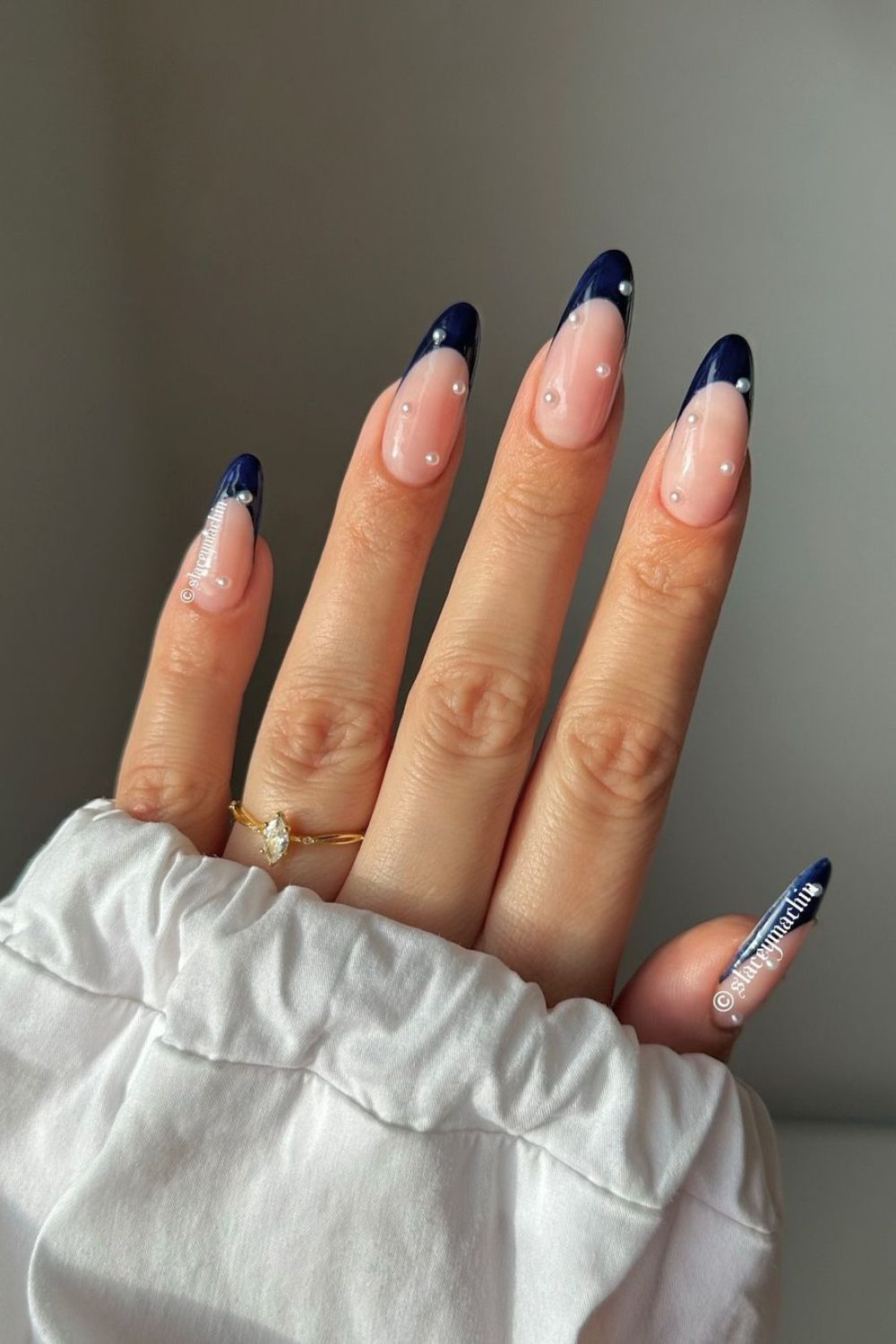 Navy french nails with pearl accents