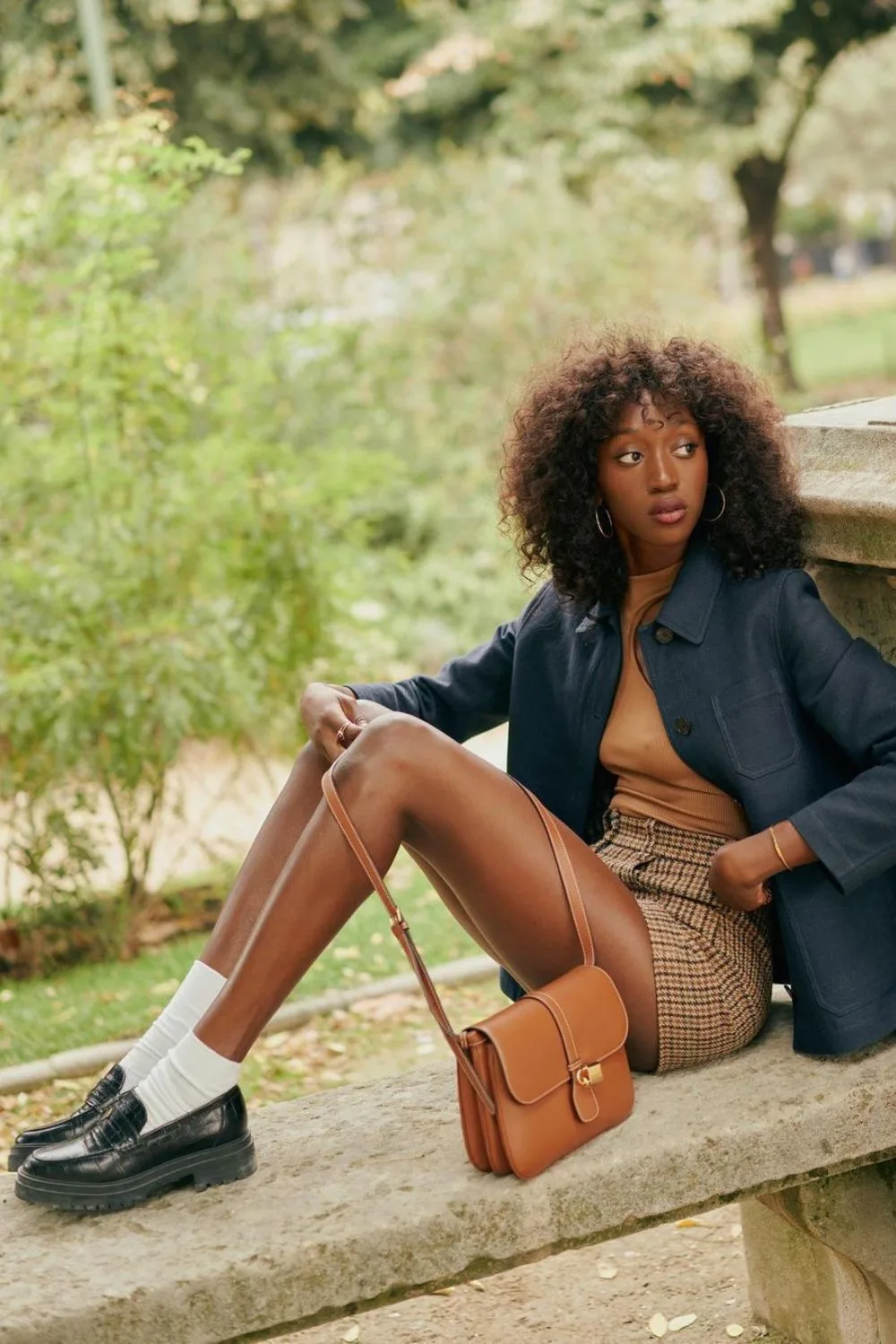 Navy jacket with plaid mini skirt and loafers