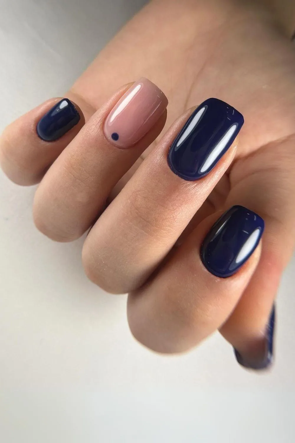 Navy nails with dot accent