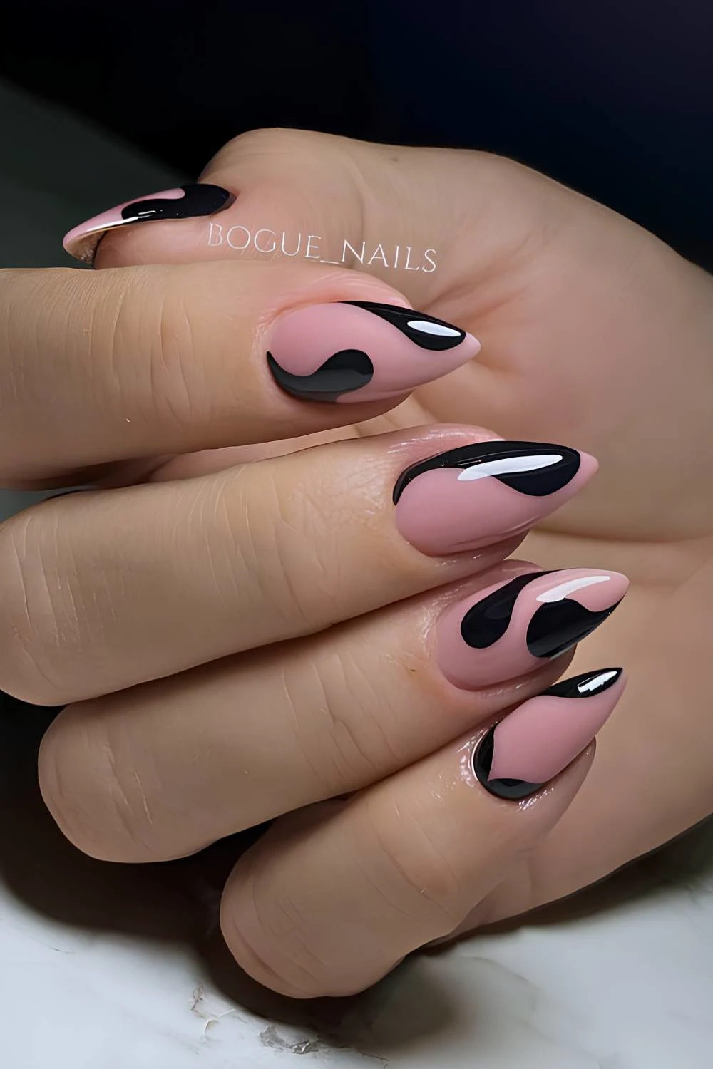 Nude nails with accent black swirls