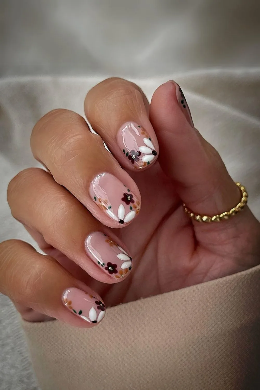 Nude nails with autumn floral accents