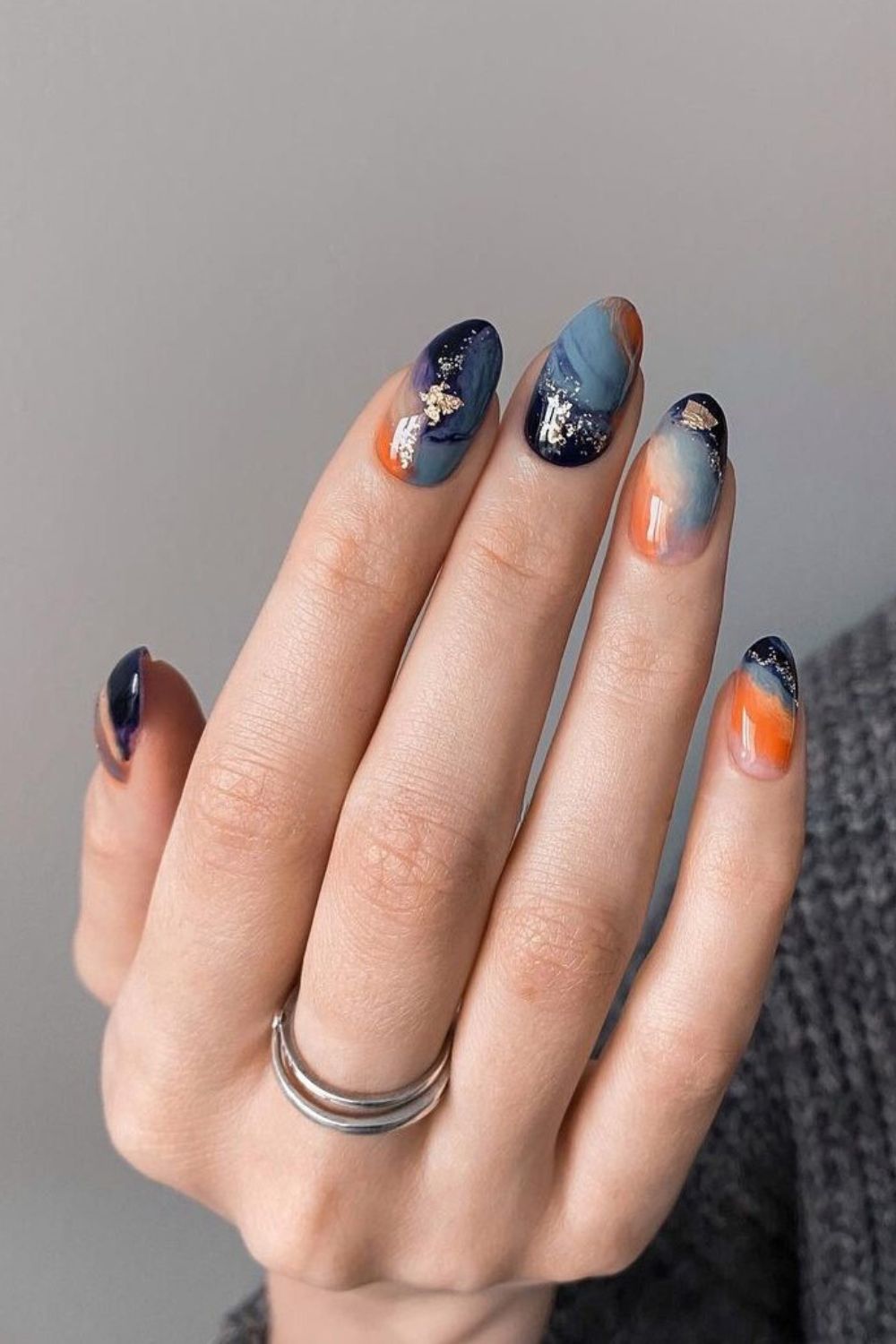 Orange and blue marble nails